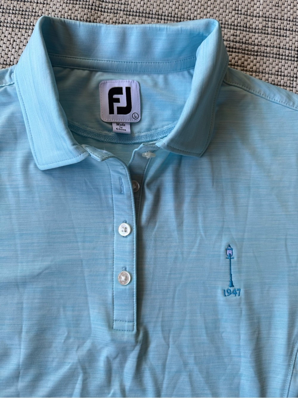 FootJoy women’s  Sky Blue Polo Shirt with Embroidered Lamp Detail